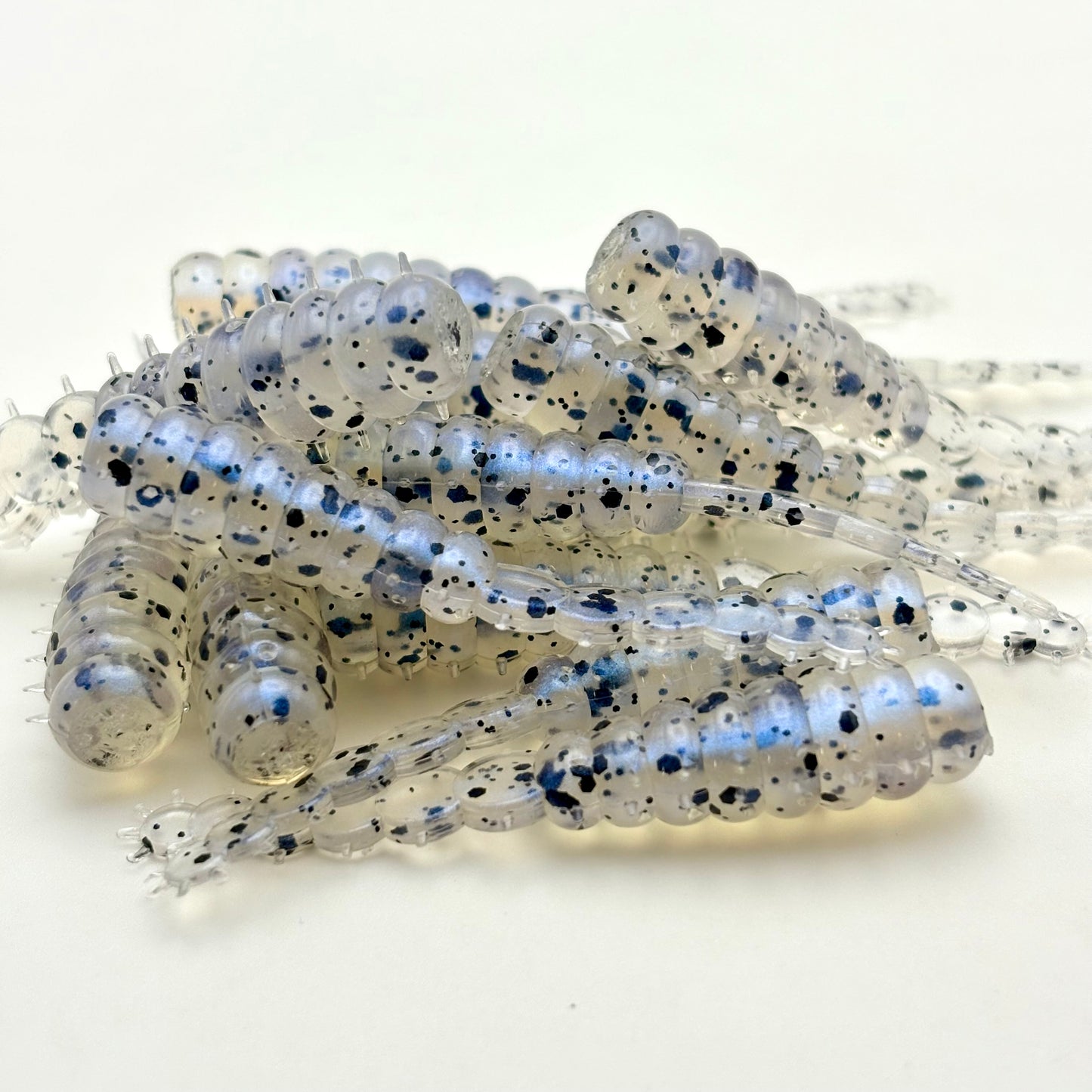 Battle Grub Send It Jigs Monkey Milk; soft plastic crappie bait; white with blue pearl shimmer and black flake