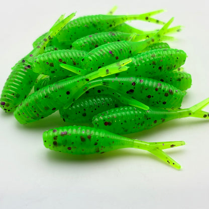 Green fishing lure with purple glitter on a white background