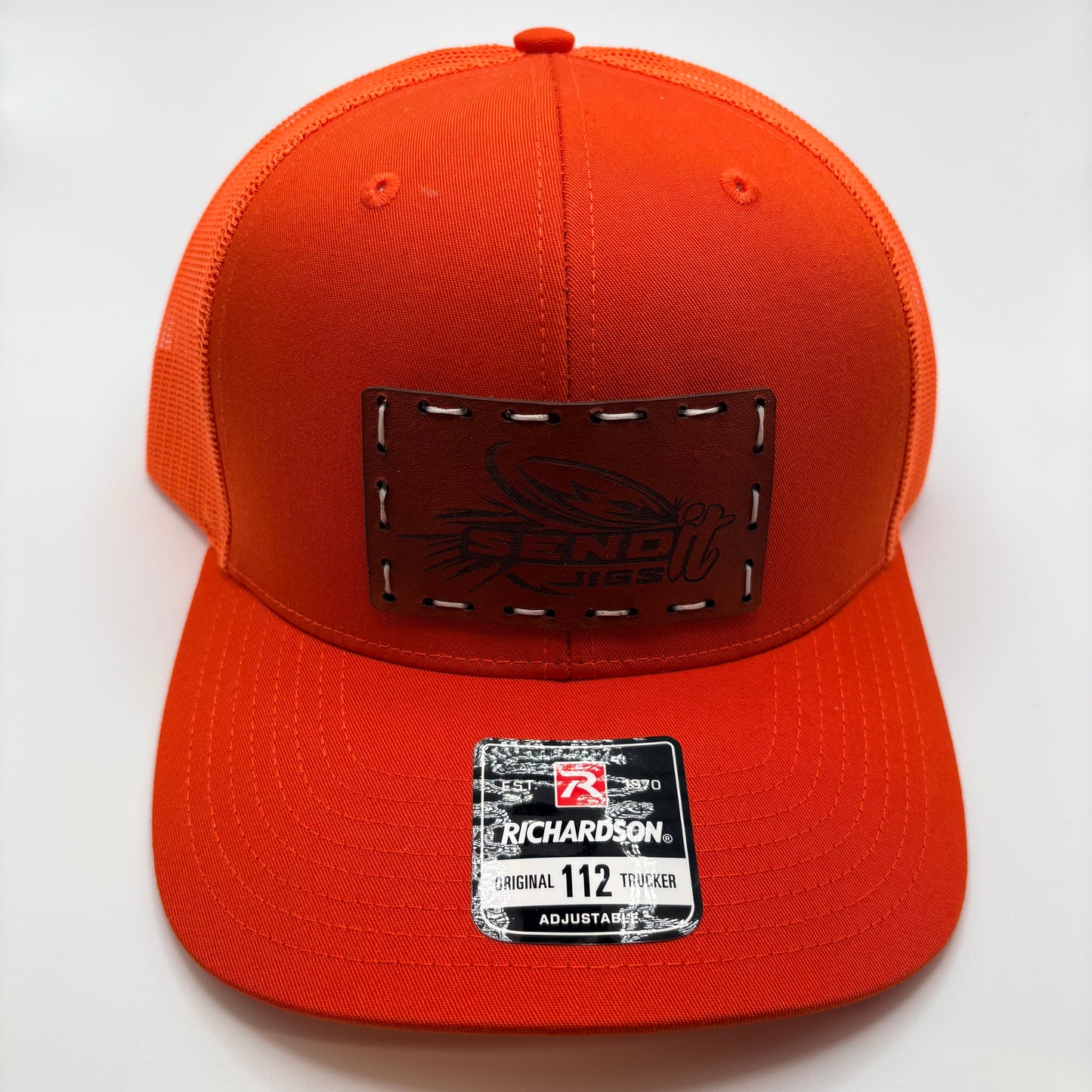 Orange cap with leather patch and Richardson label