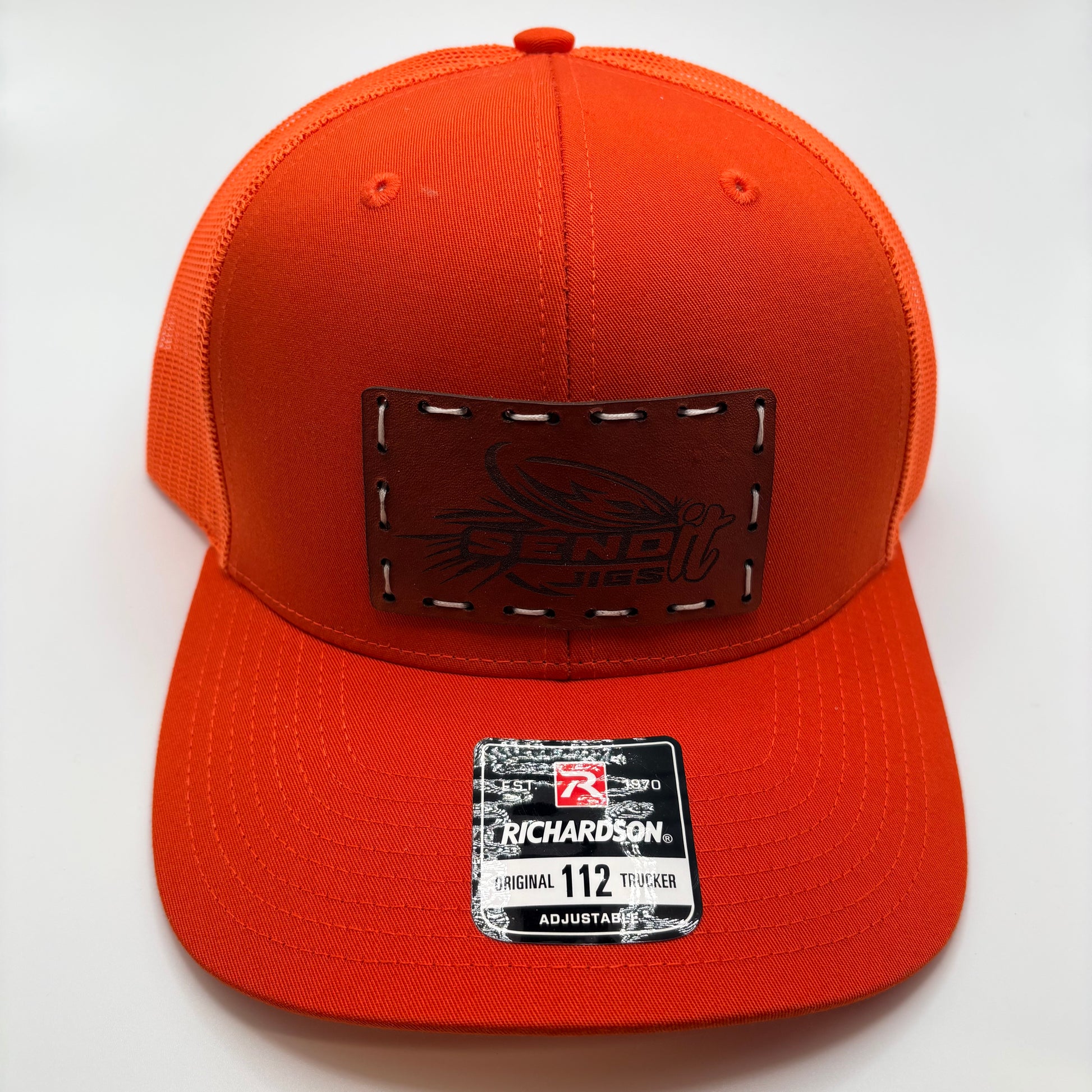 Orange cap with leather patch and Richardson label